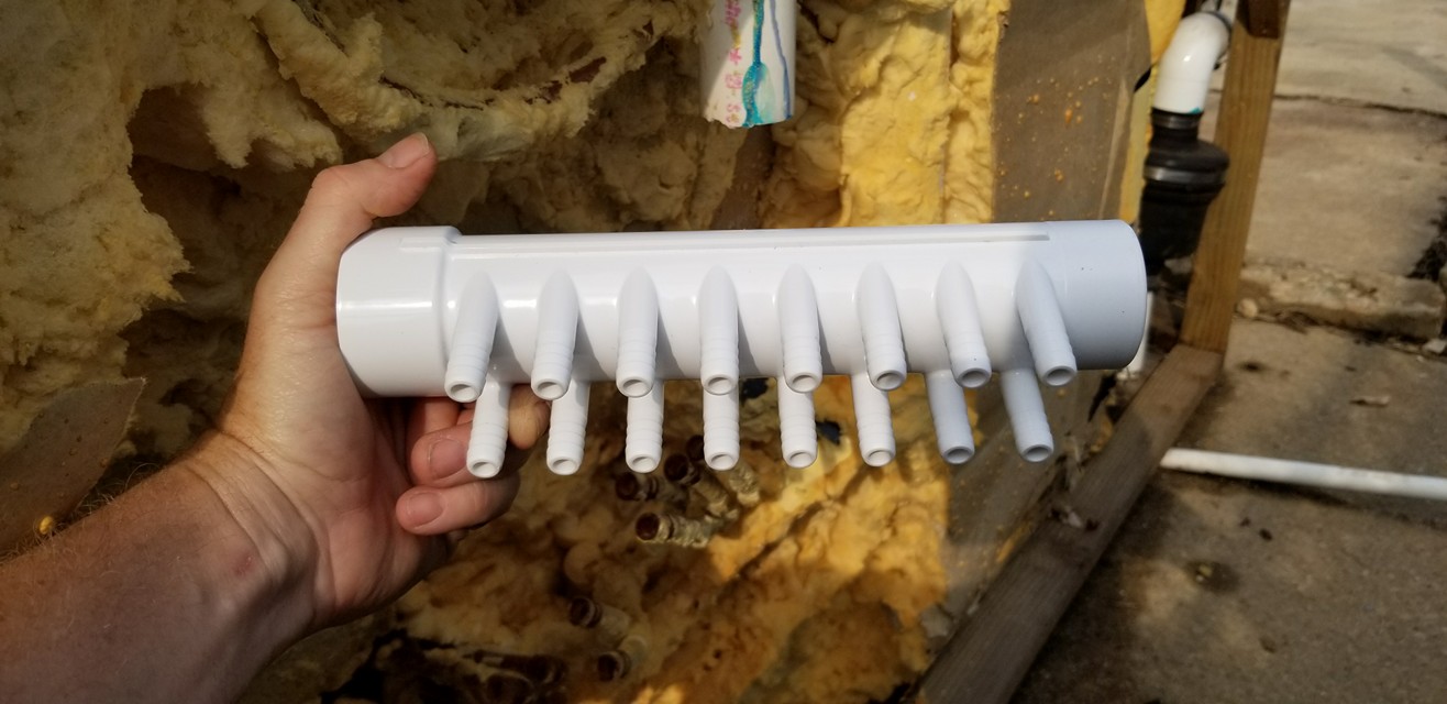 Old manifold removed and replacement manifold ready to install