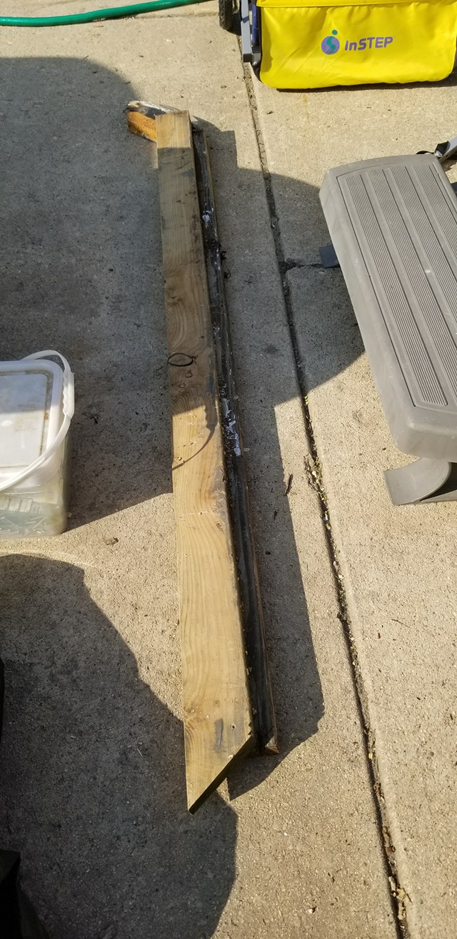 New and old 2x4 frame pieces being compared
