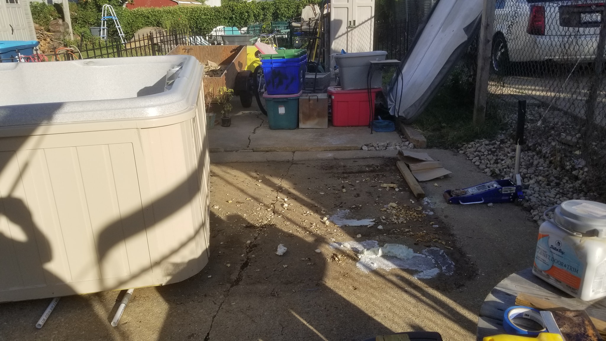 Hot tub being moved across the yard