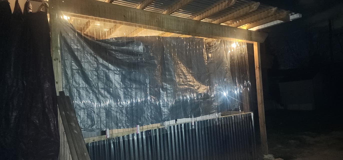 Completed hot tub pergola enclosure at night