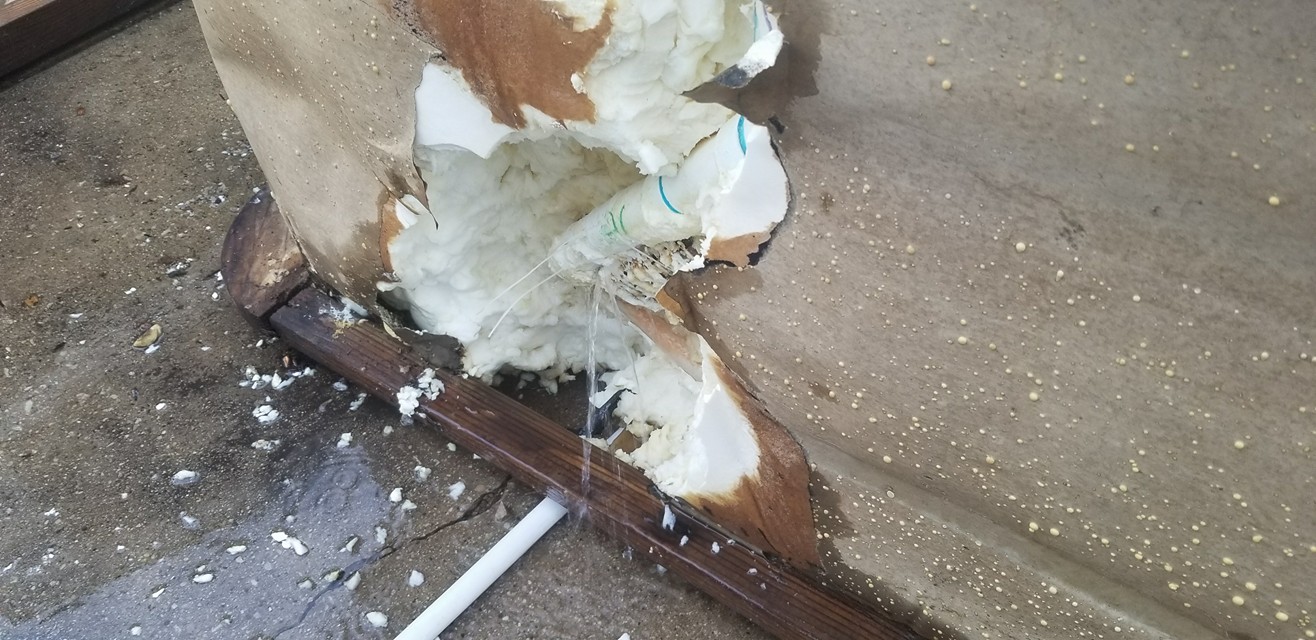 Cracked plumbing manifold inside the hot tub