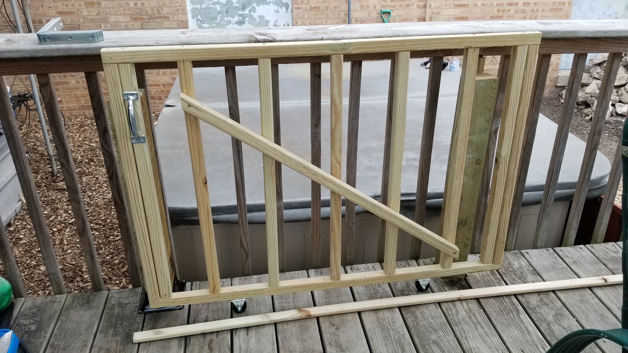 Building the sliding gate for access from the deck to the hot tub