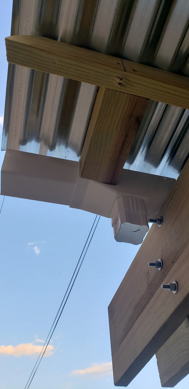 Downspout being added to pergola gutter